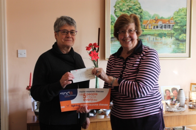 Mrs Sian Halligan presenting a cheque for £527.50 to Mrs Jean Nicholson-Smith Chair of the West Kent Motor Neuron Disease Group