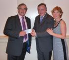 W.Bro Mark, supported by Laura, presenting a cheque for &pound;560 to the Provincial Grand Master. Christmas Lunch December 2011.